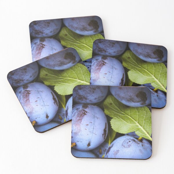 Item preview, Close up of plum fruits with green leaves designed and sold by Mahirov Shop.