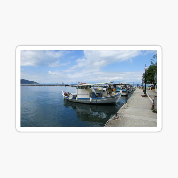 Sticker Colorful side front view of wooden fishing boat at Santorini Isl