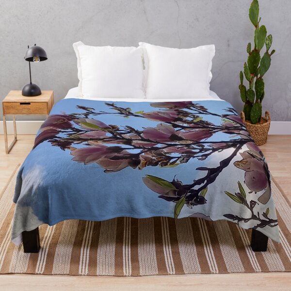 Item preview, Magnolia branches against a blue sky designed and sold by Ninaeva.