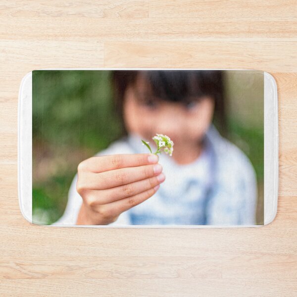Item preview, Child's hand holding a small flower designed and sold by Artsy Boulevard.