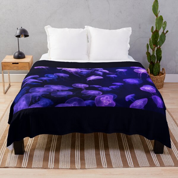 Item preview, Jellyfish animal that is found in ocean also called as Moon Jellyfish. Glowing purple color on black background designed and sold by Artsy Boulevard.
