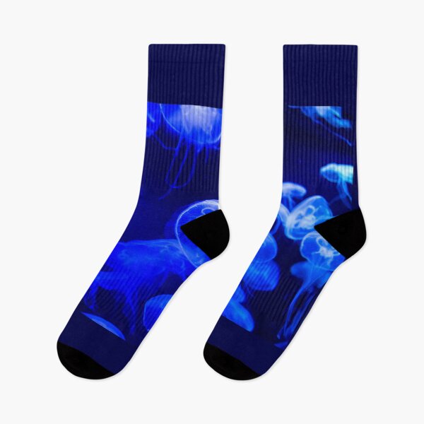 Item preview, Jellyfish animal that is found in ocean also called as Moon Jellyfish. Glowing blue color on black background designed and sold by Artsy Boulevard.