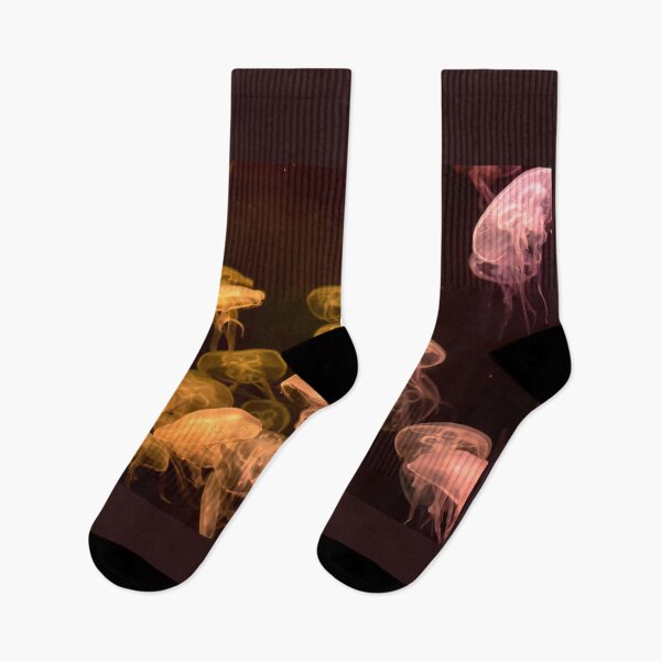 Item preview, Jellyfish animal that is found in ocean also called as Moon Jellyfish. Glowing orange color on black background designed and sold by Artsy Boulevard.
