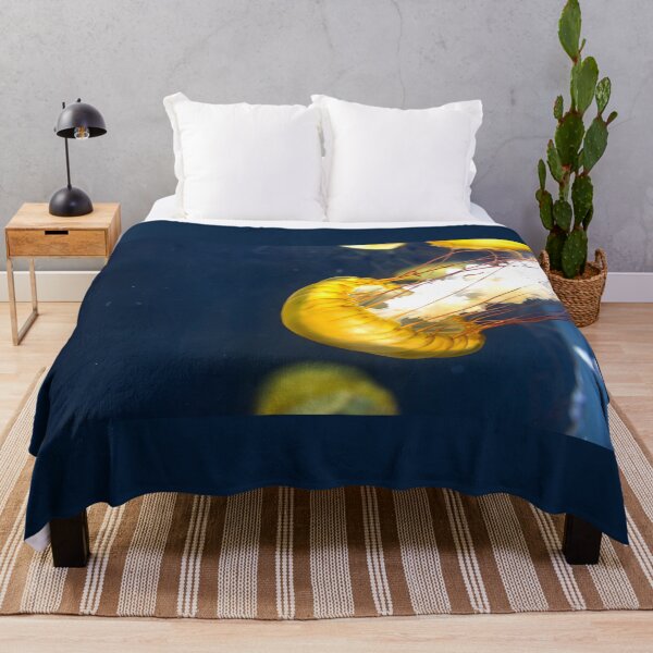 Item preview, Jellyfish sea nettle is an animal that is found in ocean also called as Medusa Jellyfish. Glowing aquatic animal yellow color on black background designed and sold by Artsy Boulevard.