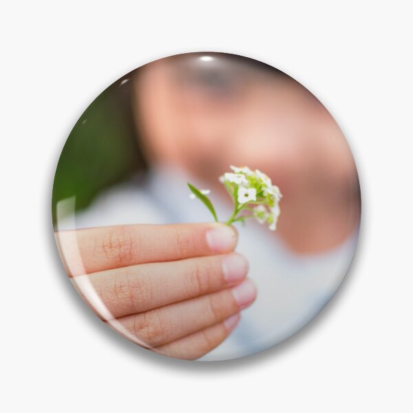 Item preview, Child's hand holding a small flower designed and sold by Artsy Boulevard.