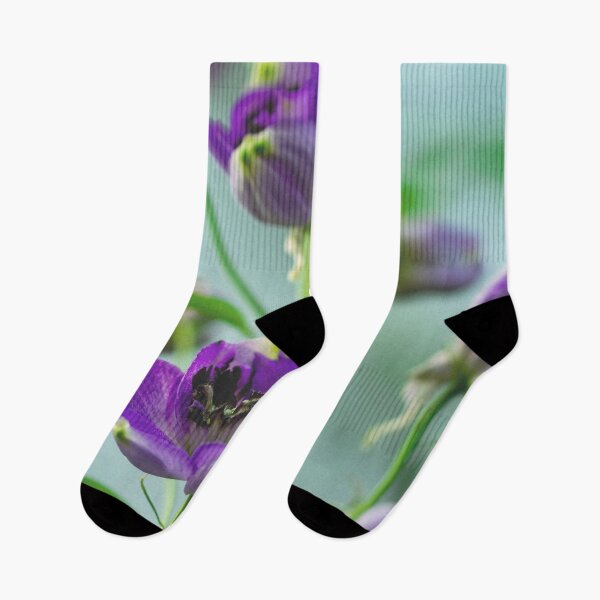 Item preview, Tulipanes de flores púrpuras con fondo verde borroso en un jardín de flores designed and sold by Artsy Boulevard.