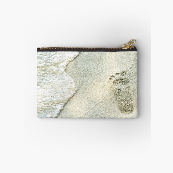 Item preview, traces of feet on the sand. Texture background Footprints of human feet on the sand near the water on the beach designed and sold by Artsy Boulevard.