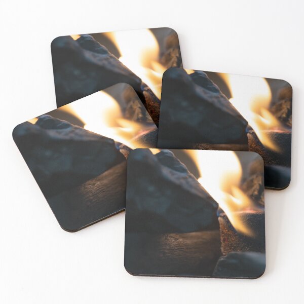 Item preview, Glowing barbecue charcoal briquettes in a BBQ coal lighter. Fire flame is started using fire starters placed among charcoal in the barbeque charcoal grill. designed and sold by Artsy Boulevard.