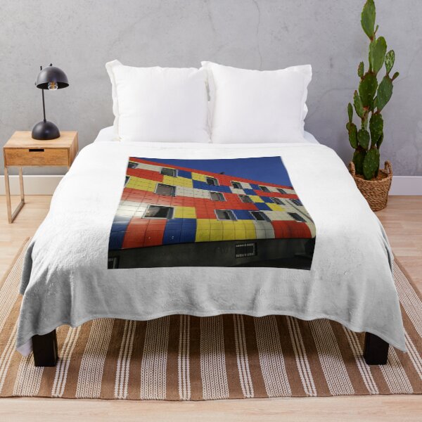 Item preview, multicolored city house against the blue sky designed and sold by Olga Kydryavskaya.