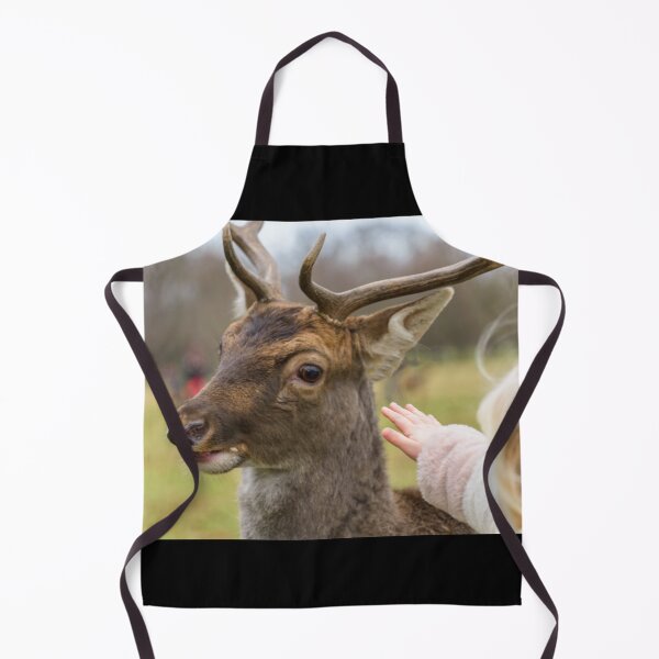 Item preview, Blonde girl playing with a friendly deer in Phoenix Park, Dublin, Ireland designed and sold by AlbertMi.