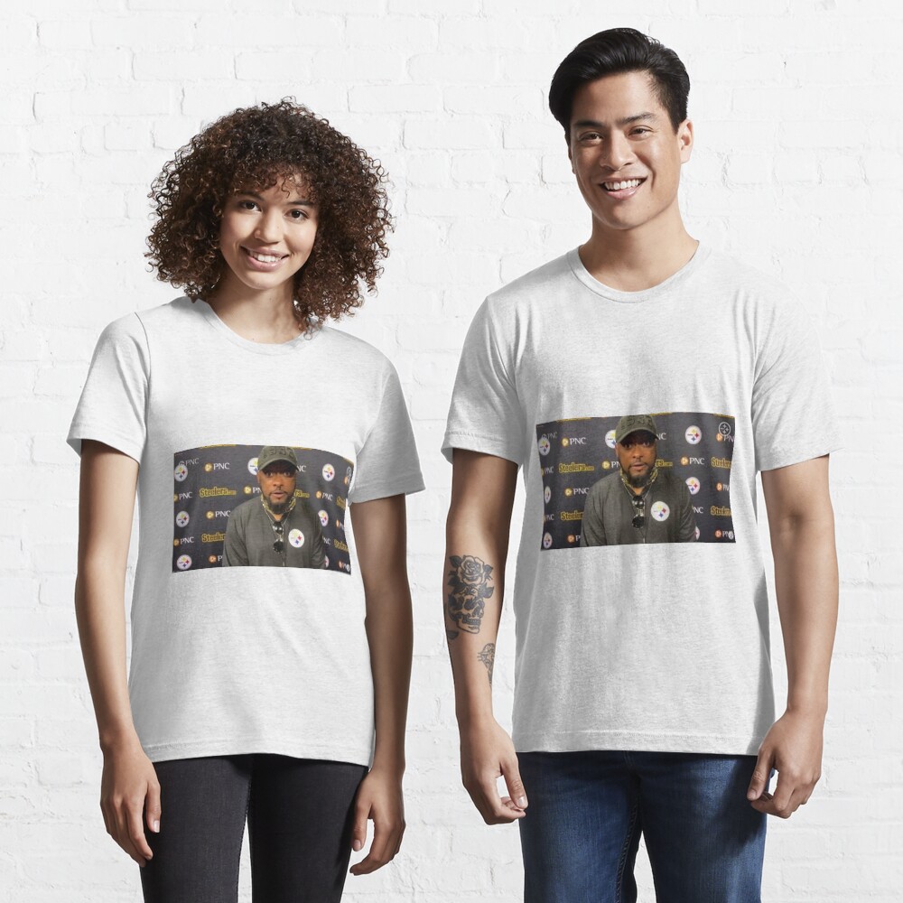 A black t-shirt with the phrase 'We Do Not Care - Mike Tomlin' printed in bold white text, featuring a minimalist design.