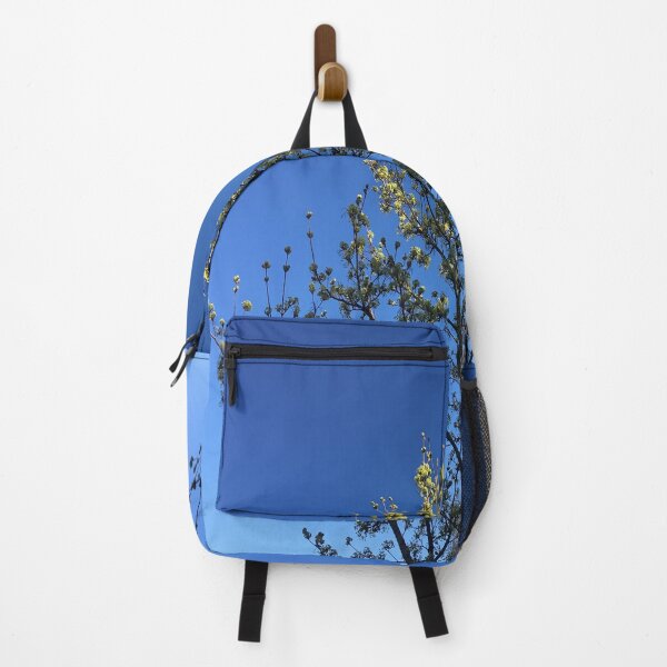 Item preview, Natural sky blue background with a blossoming flower tree, feltham town centre in united kingdom, british summertime. designed and sold by vince001.