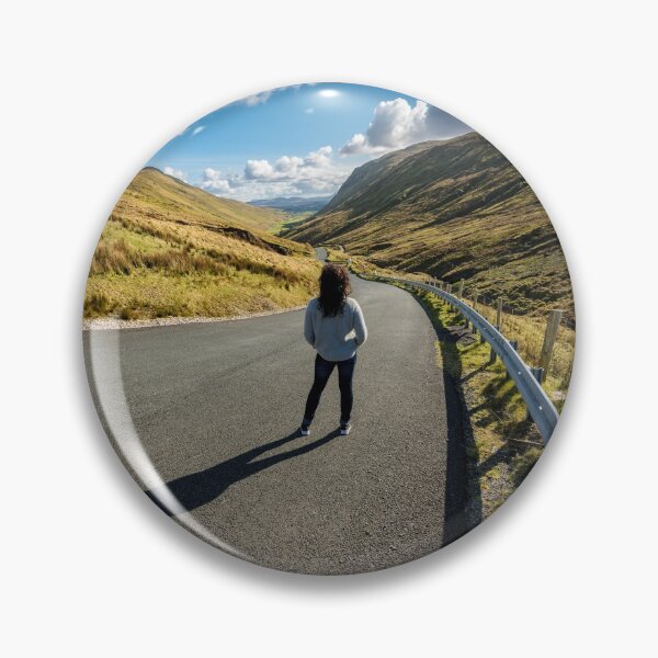 Item preview, A young beautiful woman with long curly hair stands on the highway of the Glengesh Pass between the mountains in Ardara, County Donegal, Ireland designed and sold by AlbertMi.