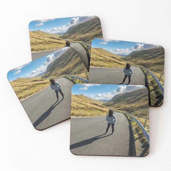 Item preview, A young beautiful woman with long curly hair stands on the highway of the Glengesh Pass between the mountains in Ardara, County Donegal, Ireland designed and sold by AlbertMi.