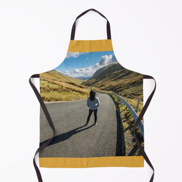 Item preview, A young beautiful woman with long curly hair stands on the highway of the Glengesh Pass between the mountains in Ardara, County Donegal, Ireland designed and sold by AlbertMi.