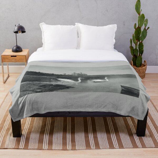 Fantasy animals swimming by a castle in Scotland Throw Blanket