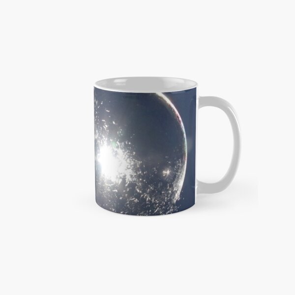 Bubble bursting on fingertip Classic Mug
