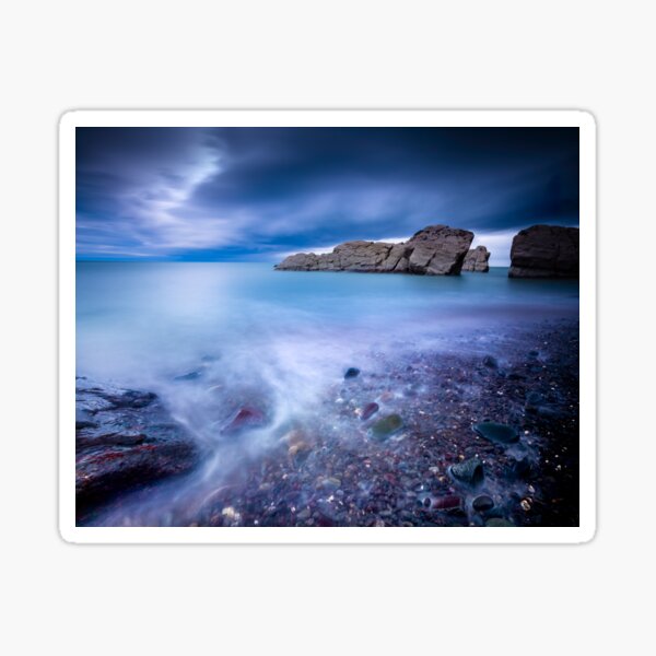 Long exposure seashore with moody sky and rocks Sticker