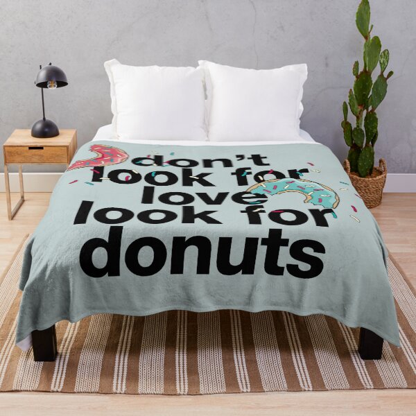 Item preview, "Don't look for love look for donuts" statement with donuts and sprinkles designed and sold by TrueType.