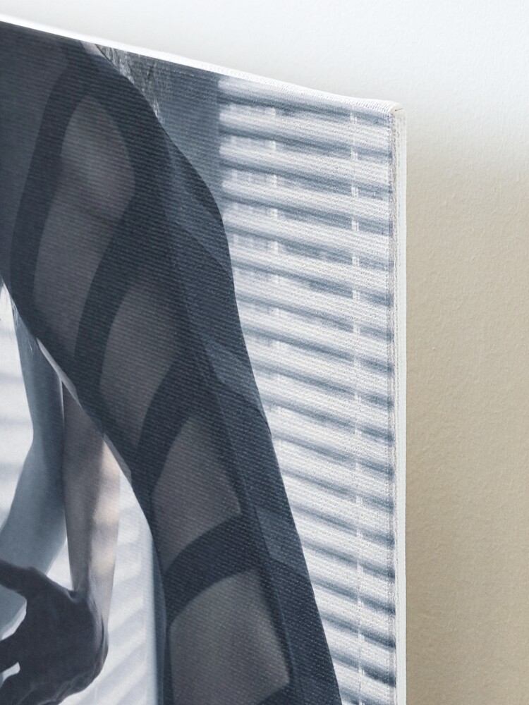 Edgy sexy fashion photo of a woman in stripy underwear in dim