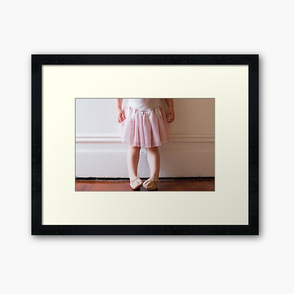 Toddler in pink tutu in hallway Framed Art Print