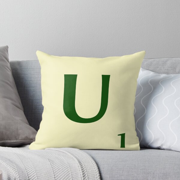 Ficha de Scrabble de la U de 1 punto Cojín