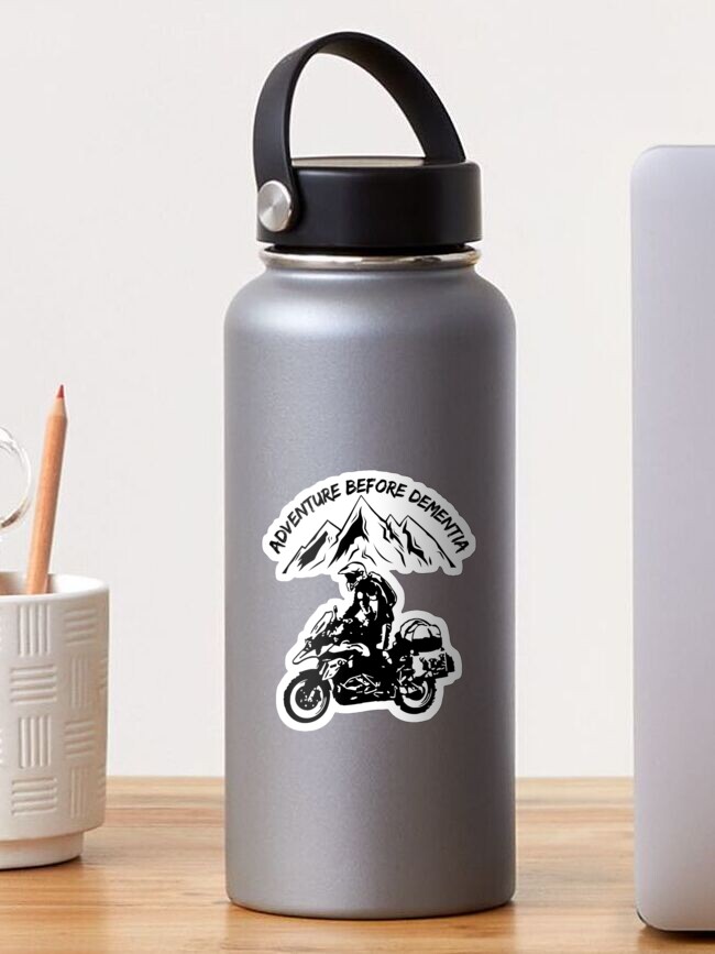 Thumbnail 1 of 3, Sticker, Adventure Before Dementia Funny Mountain Adventure Motorcycle designed and sold by Vrabis.