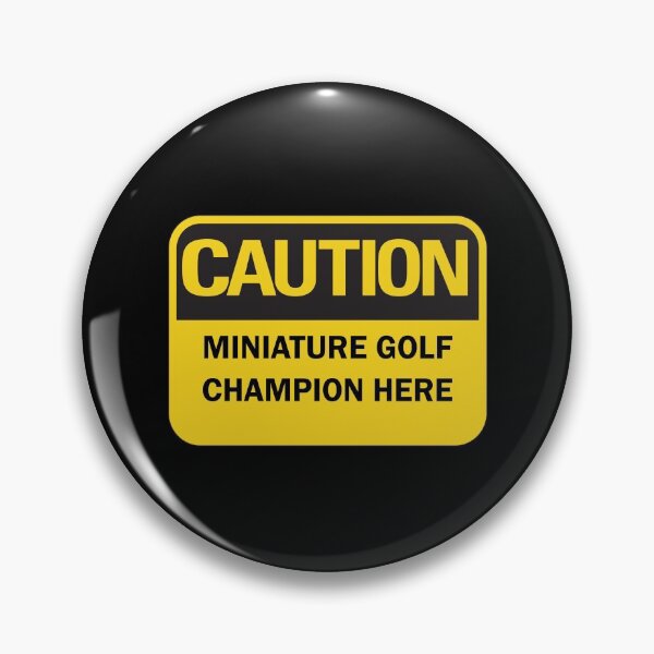 Item preview, Caution: miniature golf champion here warning saying with yellow and black typography. (Dark mode) designed and sold by Deegital18.