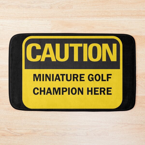 Item preview, Caution: miniature golf champion here warning saying with yellow and black typography. (Dark mode) designed and sold by Deegital18.