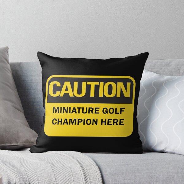 Item preview, Caution: miniature golf champion here warning saying with yellow and black typography. (Dark mode) designed and sold by Deegital18.