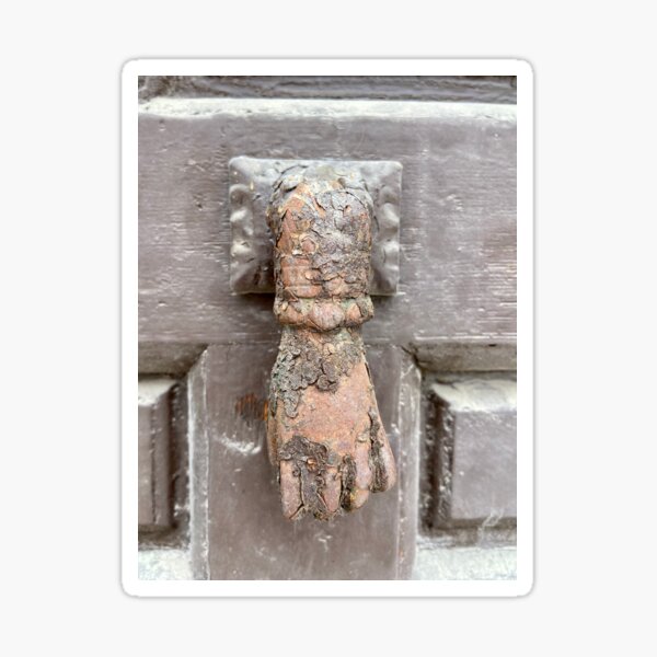 Hand shaped old door knocker Pegatina