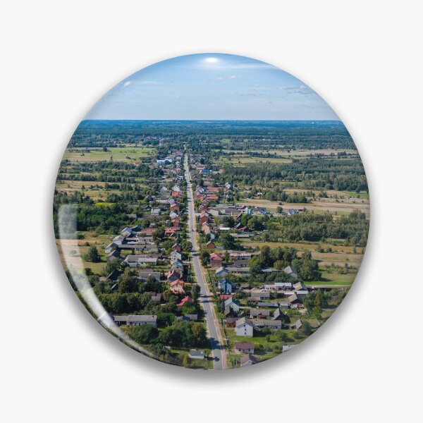 Item preview, Aerial view of village surrounded by agricultural fields under blue sky designed and sold by Lukasz Szczepanski.