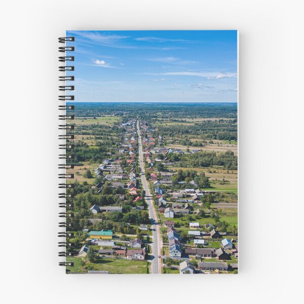Item preview, Aerial view of village surrounded by agricultural fields under blue sky designed and sold by Lukasz Szczepanski.