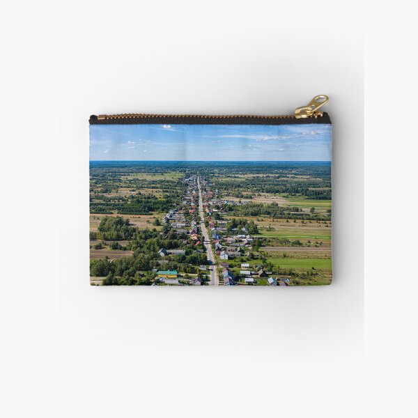 Item preview, Aerial view of village surrounded by agricultural fields under blue sky designed and sold by Lukasz Szczepanski.