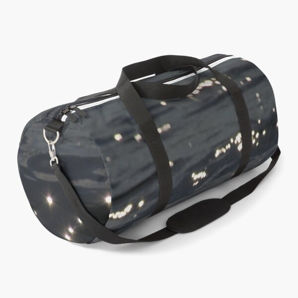 Item preview, Dark undulating water surface with reflection of sunlight designed and sold by xophotography.