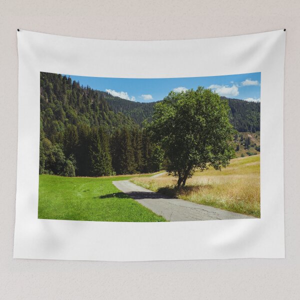 Item preview, Empty small road and tree in Black Forest, Germany designed and sold by svanaerschot.