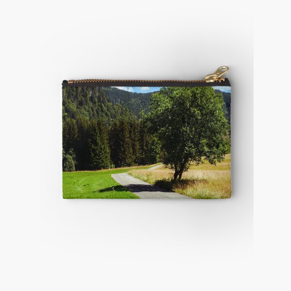 Item preview, Empty small road and tree in Black Forest, Germany designed and sold by svanaerschot.