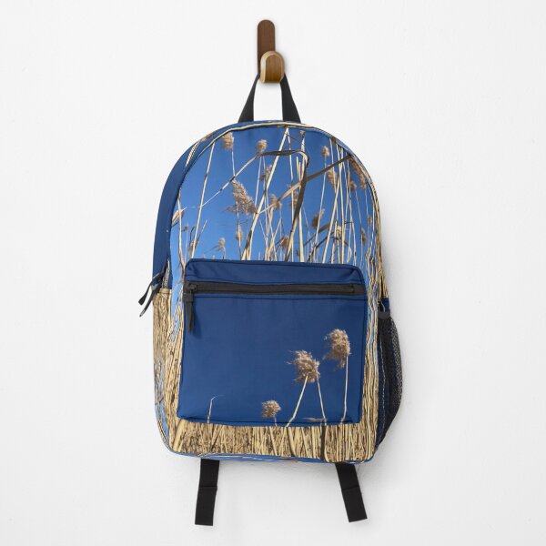 Item preview, Yellow reeds against deep blue sky designed and sold by DeliriousSteve.