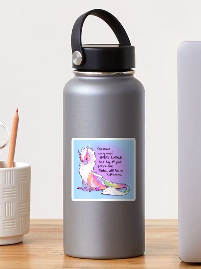 Aperçu 1 sur 3. Sticker avec l'œuvre « Tu as vaincu TOUS les mauvais jours » Dragon arc-en-ciel duveteux créée et vendue par thelatestkate.