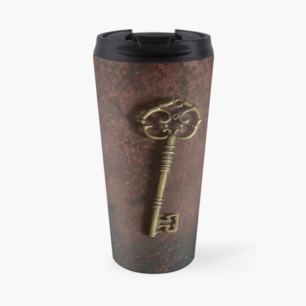Metal ornamented key and old hard covered book Travel Mug