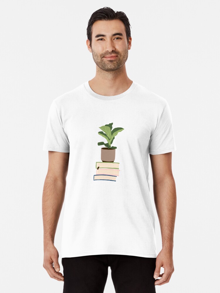 Imagen 1 de 6, Camiseta premium con la obra Planta de interior sobre libros apilados, diseñada y vendida por alanapwoods.