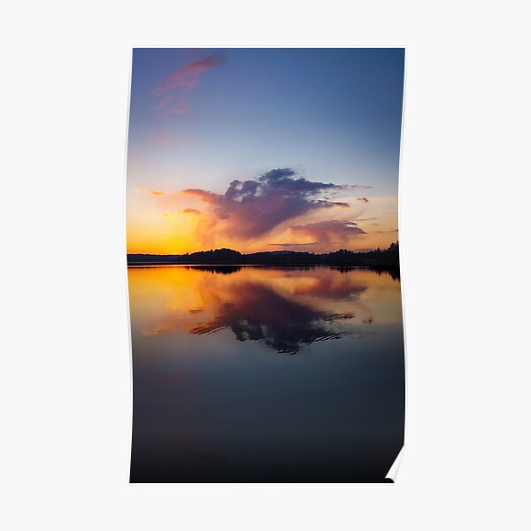 Symmetrical cloud reflection at sunset Poster