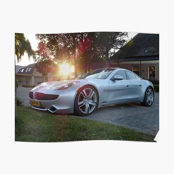 2012 Fisker Karma electric supercar against a sunset Poster