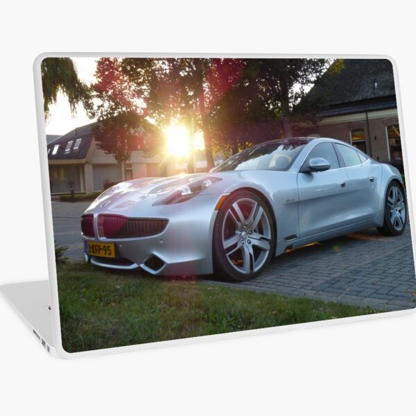 2012 Fisker Karma electric supercar against a sunset Laptop Skin
