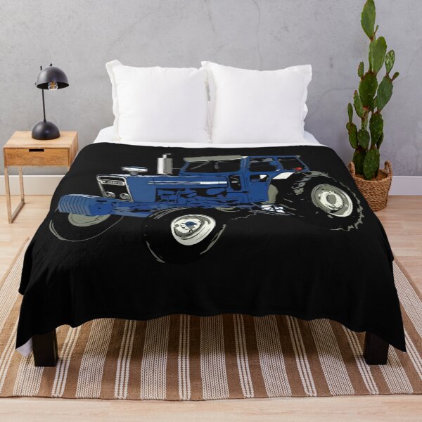 Aperçu de l'œuvre vieux tracteur Ford bleu créée et vendue par whatsyokidswear.