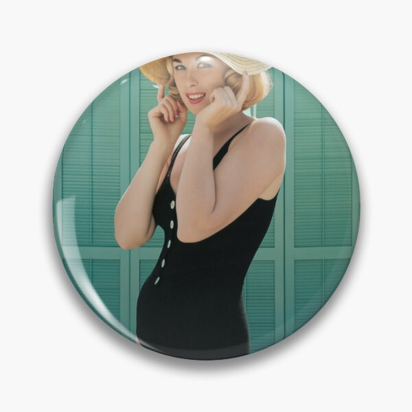 Item preview, Captivating blonde in a swimsuit presses down the brim of her sun hat. designed and sold by Lowtech.