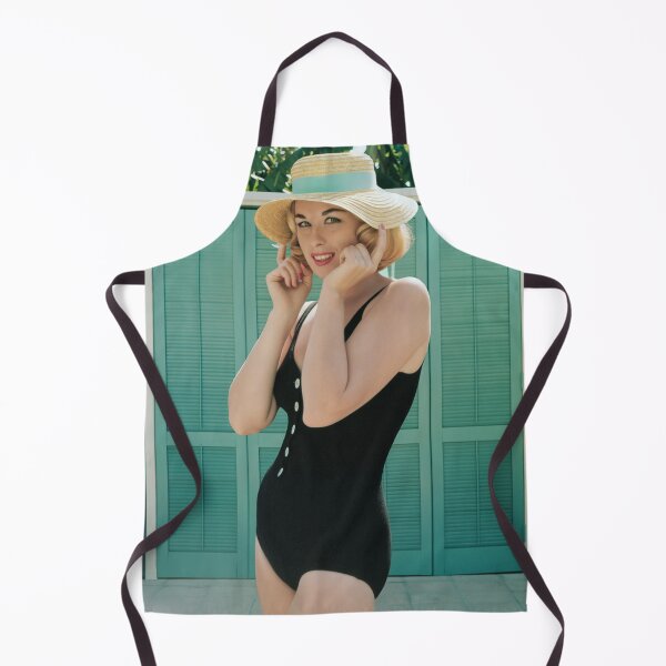 Item preview, Captivating blonde in a swimsuit presses down the brim of her sun hat. designed and sold by Lowtech.