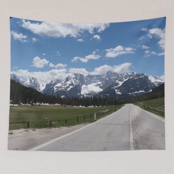 Item preview, A shot on the move from the windshield of an electric car with italian snow-covered alps mountains in front of it. Sunny spring day. POV first person view shot on a mountain road. No people. designed and sold by Maurizio Fabbroni.