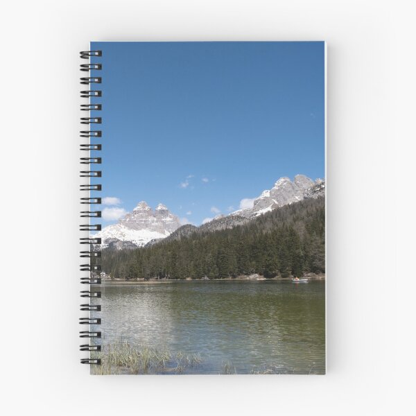 Item preview, The fabulous alpine lake of Misurina in the Dolomites. Boat on the water. Lovely and relaxing place in the Italian Alps. Reflections in the rippled water. Sunny spring day. designed and sold by Maurizio Fabbroni.