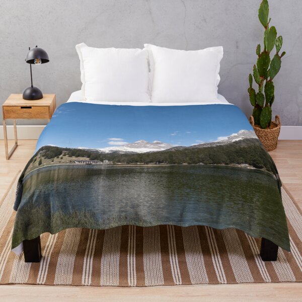 Item preview, The fabulous alpine lake of Misurina in the Dolomites. Boat on the water. Lovely and relaxing place in the Italian Alps. Reflections in the rippled water. Sunny spring day. designed and sold by Maurizio Fabbroni.